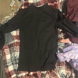 Long sleeve black turtleneck, fleece interior.